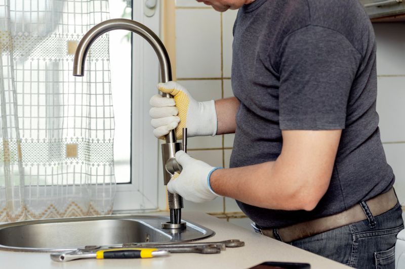 Handyman fixing a faucet